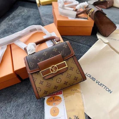 Louis Vuitton Reisse Handbag