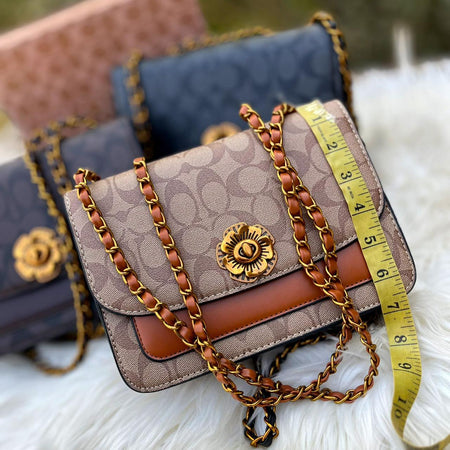 Coach Sleek Cross Body Bags