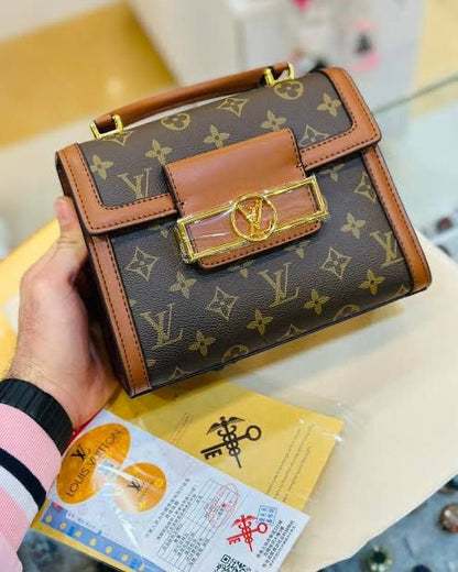 Louis Vuitton Reisse Handbag