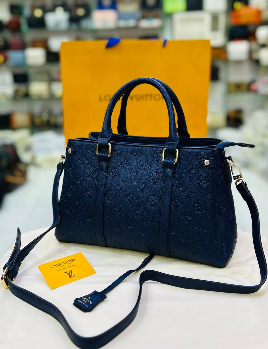 Louis Vuitton Leather 'LV' Embossed Handbag